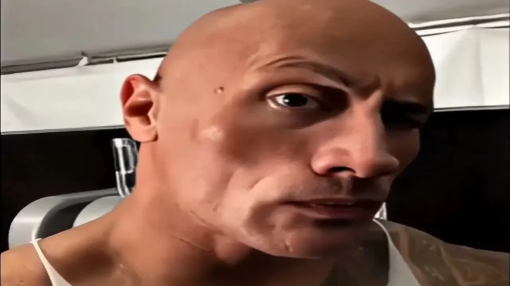 meme the rock hài hước với biểu cảm nhướng mày đặc trưng của Dwayne Johnson cận cảnh